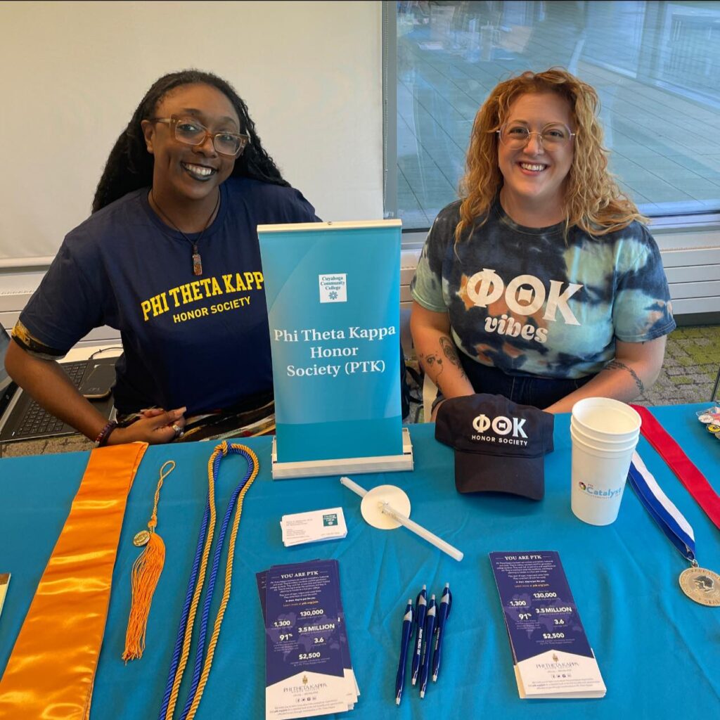 International Office Alyssa DeFlorentis tabling with another PTK Officer. 