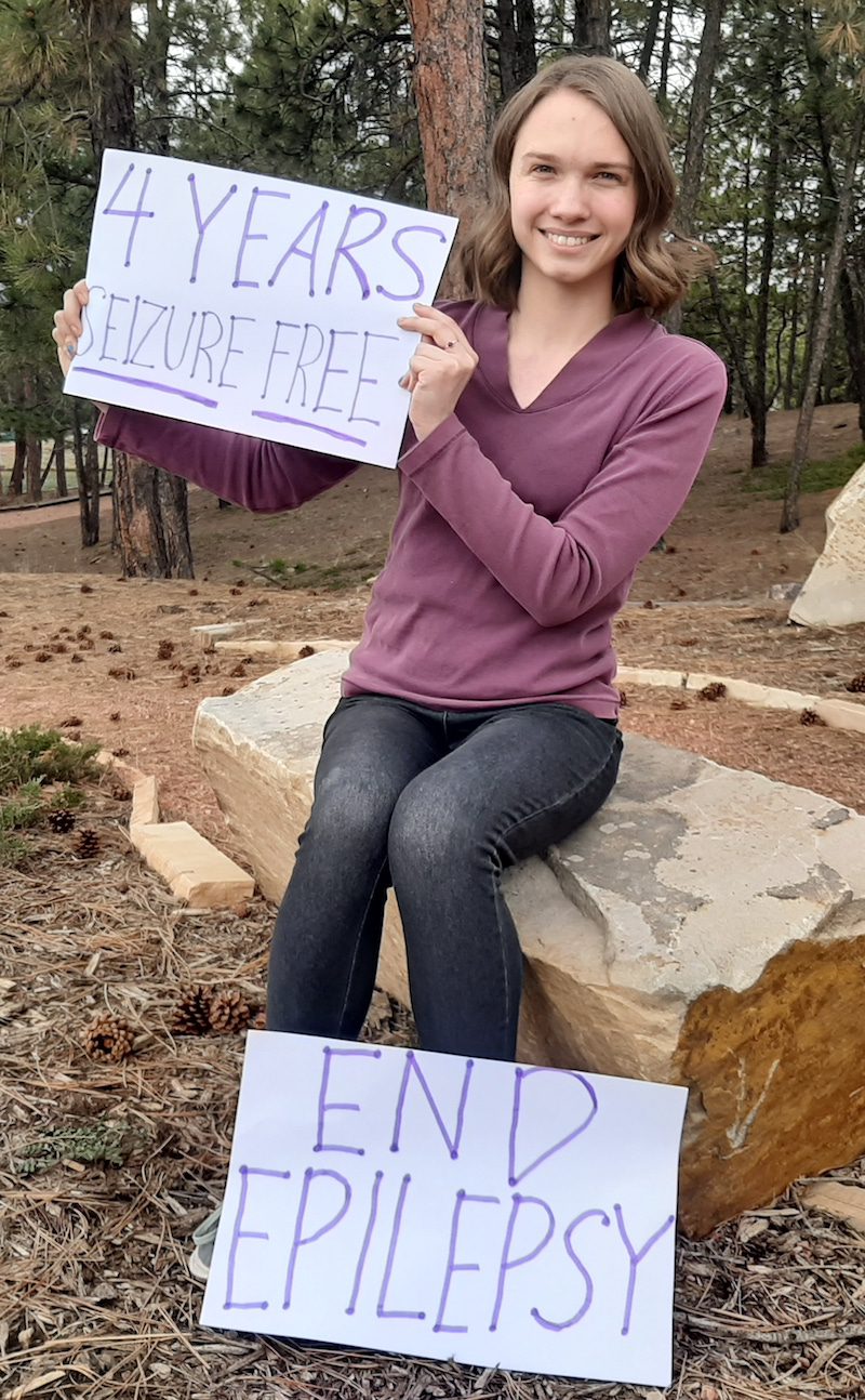 Mariah holding signs