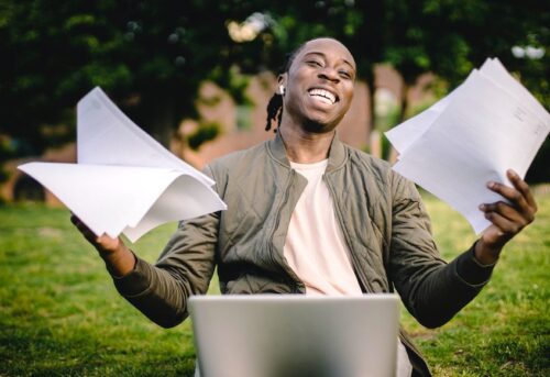 excited student at laptop