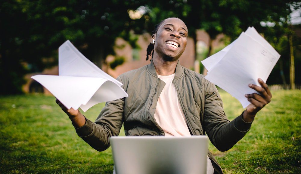 excited student at laptop