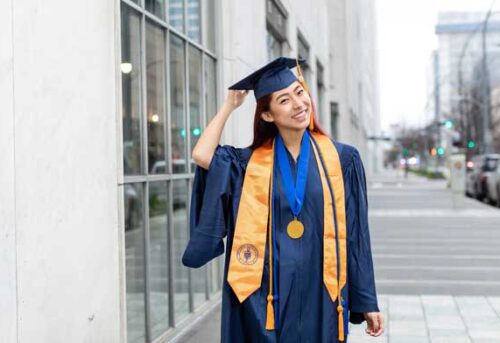 student in graduation regalia