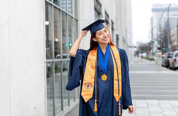 student in graduation regalia